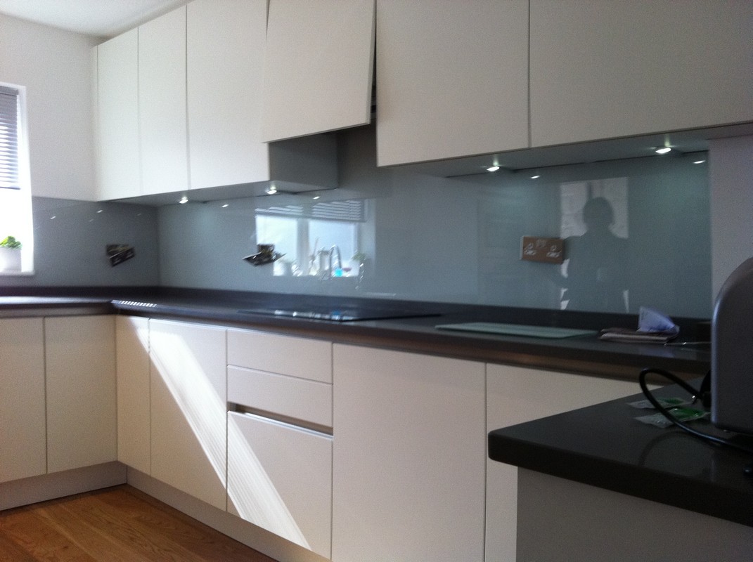 Grey glass kitchen splashback with LED lighting in Cricklewood